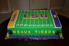 a cake that is sitting on top of a table in the shape of a football field