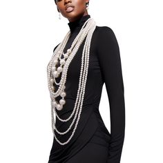 Elevate your style with our Long Gold and Chunky Cream Pearl Multi-Strand Layered Necklace Set – a luxurious fusion of opulence and sophistication. This statement piece boasts an impressive 10 layers of lustrous cream pearls creating a stunning cascade that will captivate onlookers. Features: Pearl Elegance: Adorn yourself with ten layers of exquisite cream pearls, each strand carefully selected for its radiant glow and uniform shape. Chunky Gold Chains: The intertwining with jumbo pearls adds a touch of glamour and modernity, creating a perfect balance between classic and contemporary aesthetics. Versatile Length: The long length of this necklace set offers versatility in styling, allowing you to wear it as a dramatic single strand or double it up for a chic layered look. Secure Clasp: Th Luxury Elegant Oval Beaded Necklaces, Luxury Single Strand Elegant Beaded Necklaces, Luxury Statement Necklace With Large Stone, Luxury Bohemian Double Strand Beaded Necklace, Luxury Ceremonial Jewelry With Large Beads, Outfits With Pearl Necklace Classy, Long Pearl Necklace Outfit, Styling Pearls, Necklace Styling