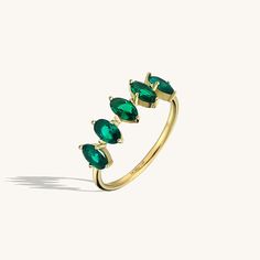 The 5 Stone Emerald Ring will demonstrate your taste with its elegancy so that you can feel yourself more stylish and special at any time of the day with the 5 Stone Emerald Ring, which will gather all the attentions around you with its sparkly emerald coloured stones, and you can make your special moments even more special. - Made in 14k solid gold - Decorated with handset emerald coloured cubic zirconia stone on 14k solid gold - Band Width: 1.45 mm / 0.057 inches- Ring Width: 18.95x6.19 mm / 0 Gemstone Jewellery Design, Dainty Band, Gemstone Collection, Luxury Jewelry Brands, Time Of The Day, Solid Gold Band, Full Eternity Ring, Emerald Color, Dream Ring