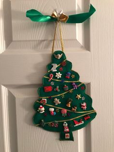 a christmas tree ornament hanging on a door