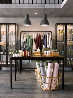 a room filled with lots of different types of towels and bottles on top of a table