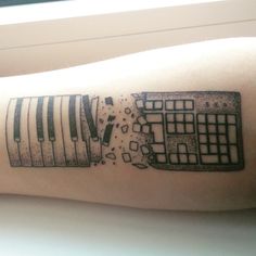 a black and white photo of a keyboard tattoo