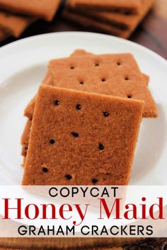 some crackers on a white plate with the words copycat honey maid graham crackers