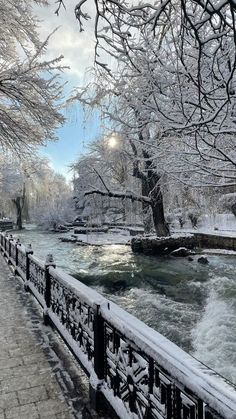 a river running through a park covered in snow