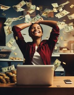 a woman sitting in front of a laptop computer with money flying out of her hands