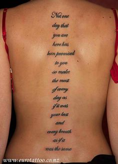 the back of a woman's body with words written on it