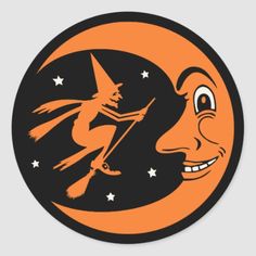 an orange and black sticker with a witch on the moon