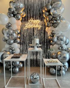 a birthday party with balloons and cake