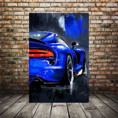 a painting of a blue sports car on a brick wall in front of a wooden floor