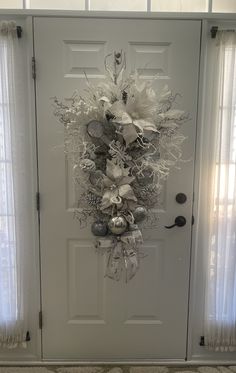 a door decorated with silver and white ornaments