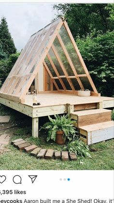 a small house built into the side of a hill with stairs leading up to it