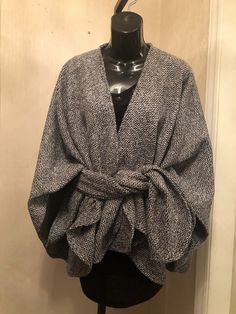 Wool and polyester blend Boucle Crop length Classic wrap with signature matching scarf. Handcrafted, Dry clean Elegant Fall Poncho For Workwear, Elegant Fall Poncho For Work, Elegant Fall Workwear Poncho, Chic Wool Poncho For Winter, Winter Shawl Scarf Outerwear, Chic Winter Shawl Cape, Cozy Wrap Outerwear For Spring, Cozy Spring Wrap Outerwear, Gray Shawl Scarves For Fall