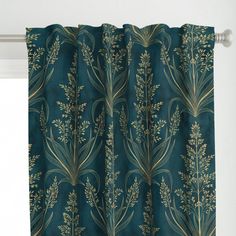 a green curtain with gold leaves on it