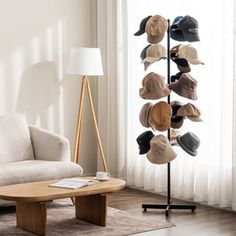 a living room with a white couch and hat rack