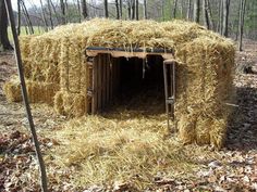 hay bales are stacked on top of each other in the woods