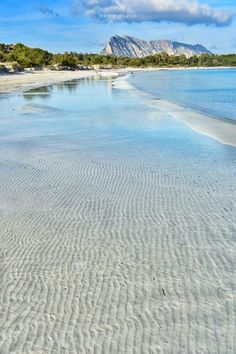 the beach is clean and empty with no people on it or any other things to see