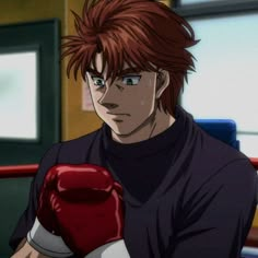 a man with red hair wearing boxing gloves