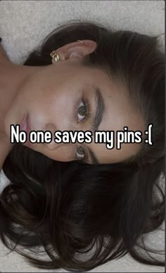 a woman laying on top of a bed with her eyes closed and the words no one saves my pins