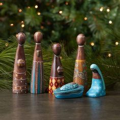 a group of wooden bowling pins sitting next to each other on top of a table