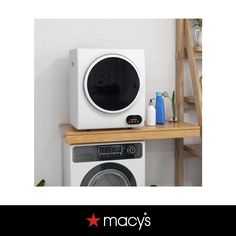 an appliance is displayed on a shelf next to a washer and dryer