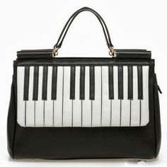 a black and white handbag with piano keys