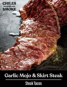 grilled steak on a grill with text overlay that reads garlic mojit and skirt steak