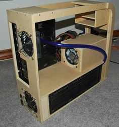 a cardboard computer case sitting on the floor