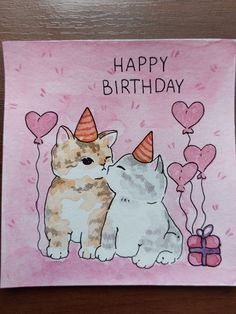 a birthday card with two cats and balloons