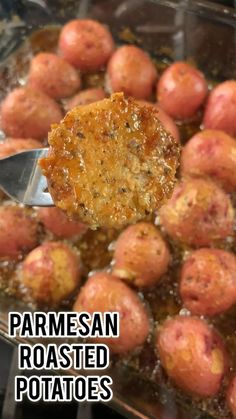 a close up of food in a pan on a stove with the words parmesan roasted potatoes