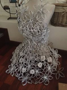 a dress made out of paper with flowers on it