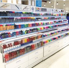 the shelves are filled with many different types of knitting needles and crochet hooks