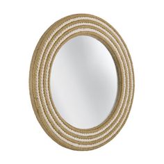 a round mirror with rope around it