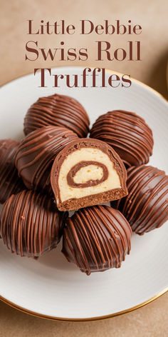 chocolate covered swiss roll truffles on a white plate with the words little debie swiss roll truffles