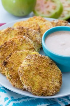 some fried food on a plate with dipping sauce