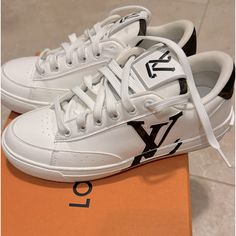 The Eco-Designed Charlie Sneaker, Crafted From 90% Sustainable Materials, Is Revisited In An All-White Version Accented With Monogram Signatures. These Include Monogram Textile Trim Made With Recycled Polyester On The Back, And An Embroidered Lv Initials Logo On The Side. The Outsole, Made From Recycled Rubber, Features The Louis Vuitton Signature. Cacao Brown Mix Of Recycled And Bio-Based Sustainable Materials Recycled Polyester Laces Recycled Rubber Outsole Lv Initials On The Side Lv Upcycling Logo On The Tongue Louis And Vuitton Signatures On The Tongue Monogram Textile Made With Recycled Polyester On The Back Louis Vuitton Signature On The Outsole Made In Italy Size 36 Comes With Box A Shoes Louis Vuitton, Initials Logo, Eco Design, Recycled Rubber, Louis Vuitton Shoes, Sustainable Materials, Womens Shoes Sneakers, Dust Bag, Initials