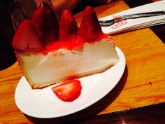 a piece of cheesecake with strawberries on top