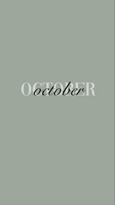 the word october written in black on a gray background