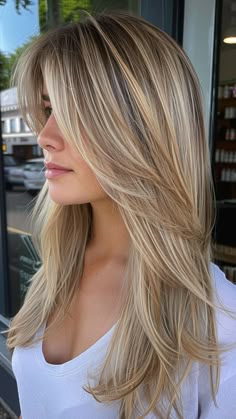 Revamp your long locks with front layers and a shadow root, the epitome of modern style and sophistication for 2024. These face-framing layers with a shadow root add depth and dimension, enhancing your natural beauty with a touch of edge. Click the pin and follow us for more top style trends! #Haircuts #Hairstyle #LongHair #FrontLayers #StyleTrends Butterfly Blonde Hair, Butterfly Haircut Blonde, Long Front Layers Face Framing, Front Layers Long Hair Face Framing, Heavy Layers Medium Hair, Front Blond, Edgy Butterfly, Wavy Layered Haircuts, Butterfly Haircuts