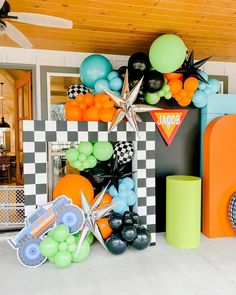 an assortment of balloons and decorations on display