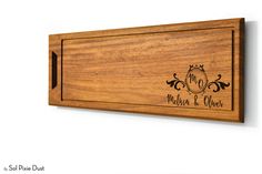 a wooden plaque with the words, mom and dad engraved on it's side