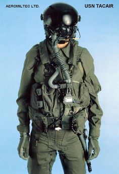 an air force pilot is posing for the camera with his gas mask and goggles on