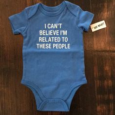 a baby bodysuit that says i can't believe i'm related to these people