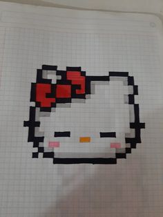 a piece of paper with an image of a hello kitty face on it, in the shape of a grid