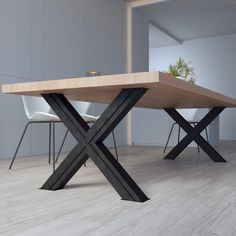 a wooden table sitting on top of a hard wood floor