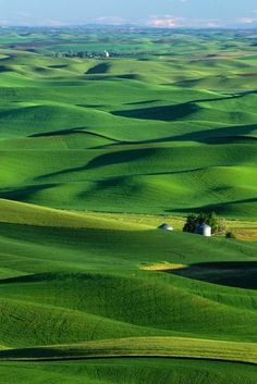 an aerial view of the rolling green hills