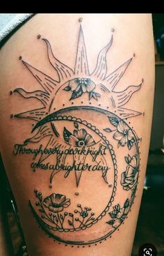 a woman's thigh with the sun and stars on it, in black ink