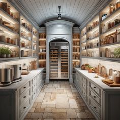 a very large kitchen with lots of counter space and shelves filled with pots and pans