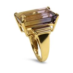 Make a bold statement with this captivating 10K Yellow Gold Ametrine Cocktail Ring. The focal point is an impressive emerald-cut ametrine, measuring 18.7x13.03x8.76mm, and boasting an estimated carat weight of 13.66. The ametrine, with its mesmerizing blend of amethyst and citrine hues, is securely cradled in a 4-prong basket setting, allowing its vibrant colors to shine. The shank of the ring features stepped shoulders, adding an extra touch of sophistication to the design. Tapering gracefully Ametrine Ring, Amethyst And Citrine, Vintage Cocktail Ring, Basket Setting, Vintage Cocktail, Fine Jewels, Online Jewelry Store, Healing Stone, Cocktail Ring