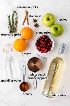 ingredients to make cranberry apple cider recipe laid out on a marble surface