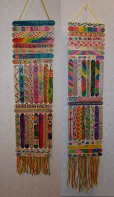 two wall hangings made out of different colored fabrics